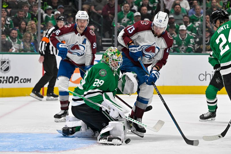 May 7, 2024; Dallas, Texas, USA; Colorado Avalanche right wing Mikko Rantanen (96) and right wing Valeri Nichushkin (13) and Dallas Stars goaltender Jake Oettinger (29) and center Roope Hintz (24) battle for control of the puck in the Stars zone during the first period in game one of the second round of the 2024 Stanley Cup Playoffs at American Airlines Center. Mandatory Credit: Jerome Miron-USA TODAY Sports