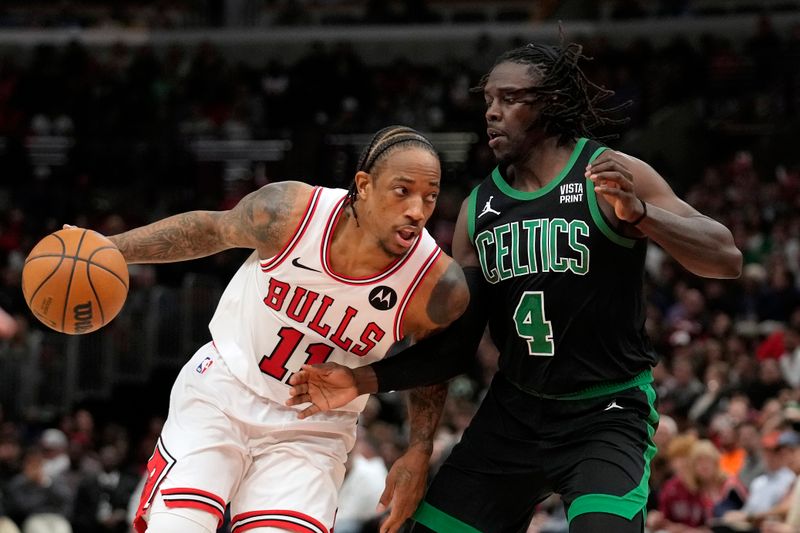 CHICAGO, ILLINOIS - FEBRUARY 22: DeMar DeRozan #11 of the Chicago Bulls dribbles the ball against Jrue Holiday #4 of the Boston Celtics during the second half at the United Center on February 22, 2024 in Chicago, Illinois. NOTE TO USER: User expressly acknowledges and agrees that, by downloading and or using this photograph, User is consenting to the terms and conditions of the Getty Images License Agreement. (Photo by Patrick McDermott/Getty Images)