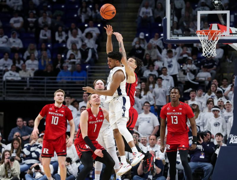 Feb 26, 2023; University Park, Pennsylvania, USA; Penn State Nittany Lions guard Camren Wynter (11) and Rutgers Scarlet Knights guard Caleb McConnell (22) jump for the loose ball during the second half at Bryce Jordan Center. Rutgers defeated Penn State 59-56. Mandatory Credit: Matthew OHaren-USA TODAY Sports