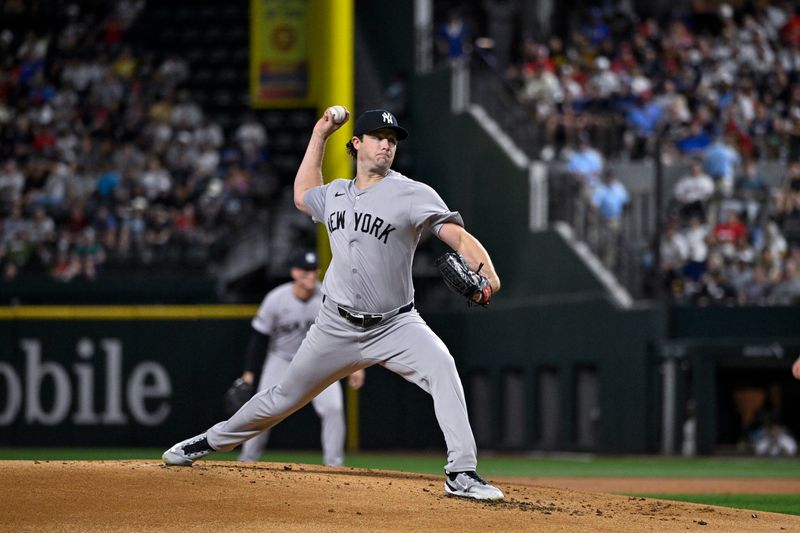 Sep 2, 2024; Arlington, Texas, USA; New York Yankees starting pitcher Gerrit Cole (45) pitches against the Texas Rangers during the first inning at Globe Life Field. Mandatory Credit: Jerome Miron-USA TODAY Sports