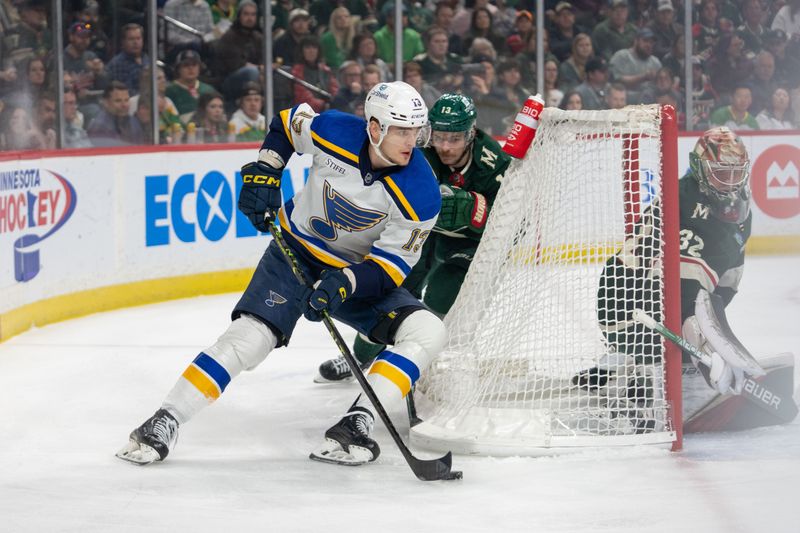 Apr 8, 2023; Saint Paul, Minnesota, USA; St. Louis Blues right wing Alexey Toropchenko (13) tries a wrap around shot, defended by Minnesota Wild goaltender Marc-Andre Fleury (29) and center Sam Steel (13) in the first period at Xcel Energy Center. Mandatory Credit: Matt Blewett-USA TODAY Sports