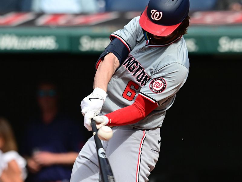 Jun 1, 2024; Cleveland, Ohio, USA; Washington Nationals designated hitter Jesse Winker (6) hits an RBI single during the fourth inning against the Cleveland Guardians at Progressive Field. Mandatory Credit: Ken Blaze-USA TODAY Sports