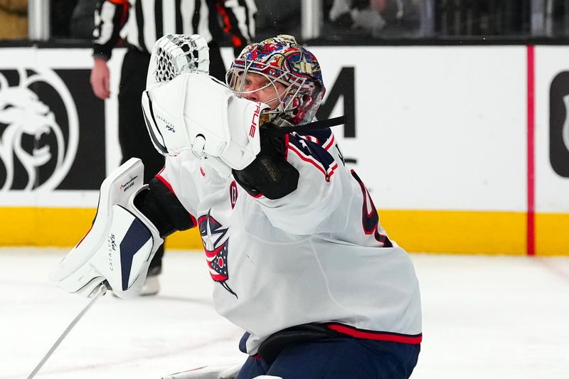 Jan 30, 2025; Las Vegas, Nevada, USA; Columbus Blue Jackets goaltender Elvis Merzlikins (90) makes a glove save against the Vegas Golden Knights during the second period at T-Mobile Arena. Mandatory Credit: Stephen R. Sylvanie-Imagn Images