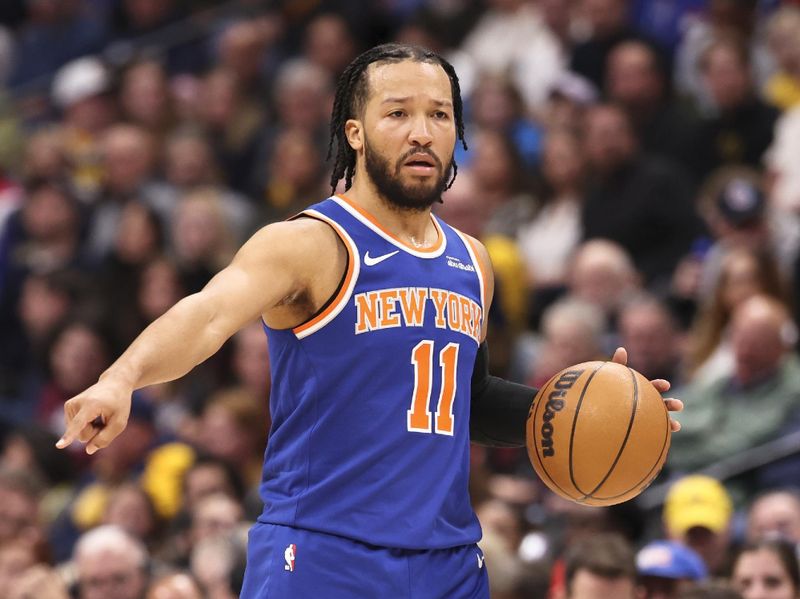 DENVER, COLORADO - NOVEMBER 25: Jalen Brunson #11 of the New York Knicks brings the ball up the court against the Denver Nuggets during the first half at Ball Arena on November 25, 2024 in Denver, Colorado. NOTE TO USER: User expressly acknowledges and agrees that, by downloading and/or using this Photograph, user is consenting to the terms and conditions of the Getty Images License Agreement. (Photo by Justin Tafoya/Getty Images)