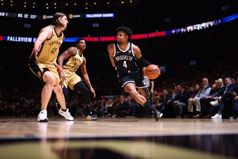 TORONTO, CANADA - FEBRUARY 22: Dennis Smith Jr. #4 of the Brooklyn Nets handles the ball during the game against the Toronto Raptors on February 22, 2024 at the Scotiabank Arena in Toronto, Ontario, Canada.  NOTE TO USER: User expressly acknowledges and agrees that, by downloading and or using this Photograph, user is consenting to the terms and conditions of the Getty Images License Agreement.  Mandatory Copyright Notice: Copyright 2024 NBAE (Photo by Vaughn Ridley/NBAE via Getty Images)