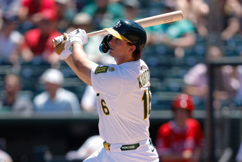 May 22, 2025; West Sacramento, California, USA; Athletics first baseman Nick Kurtz (16) hits a sacrifice fly RBI during the during the third inning against the Los Angeles Angels at Sutter Health Park. Mandatory Credit: Sergio Estrada-Imagn Images