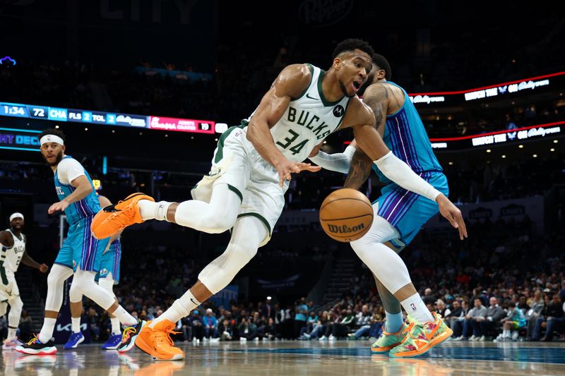 CHARLOTTE, NORTH CAROLINA - FEBRUARY 29: Giannis Antetokounmpo #34 of the Milwaukee Bucks drives to the basket against Miles Bridges #0 of the Charlotte Hornets during the second half of the game at Spectrum Center on February 29, 2024 in Charlotte, North Carolina. NOTE TO USER: User expressly acknowledges and agrees that, by downloading and or using this photograph, User is consenting to the terms and conditions of the Getty Images License Agreement. (Photo by Jared C. Tilton/Getty Images)