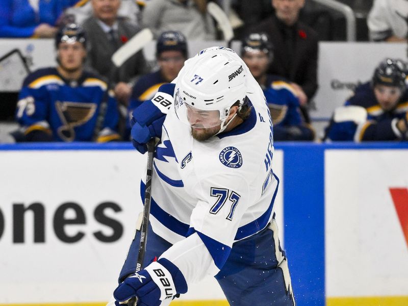 Nov 5, 2024; St. Louis, Missouri, USA;  Tampa Bay Lightning defenseman Victor Hedman (77) shoots against the Tampa Bay Lightning during the first period at Enterprise Center. Mandatory Credit: Jeff Curry-Imagn Images