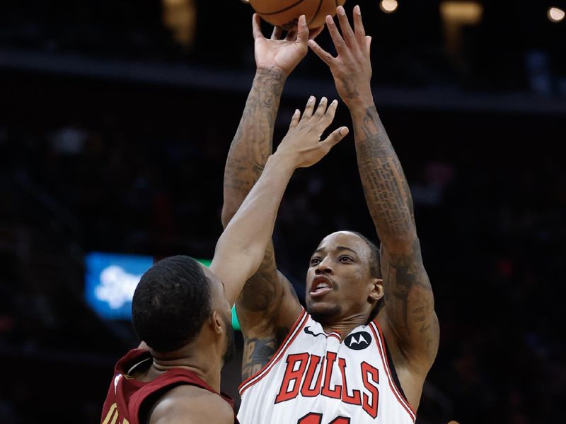 CLEVELAND, OH - FEBRUARY 14: DeMar DeRozan #11 of the Chicago Bulls shoots against Evan Mobley #4 of the Cleveland Cavaliers during the second half at Rocket Mortgage Fieldhouse on February 14, 2024 in Cleveland, Ohio. NOTE TO USER: User expressly acknowledges and agrees that, by downloading and or using this photograph, User is consenting to the terms and conditions of the Getty Images License Agreement. (Photo by Ron Schwane/Getty Images)