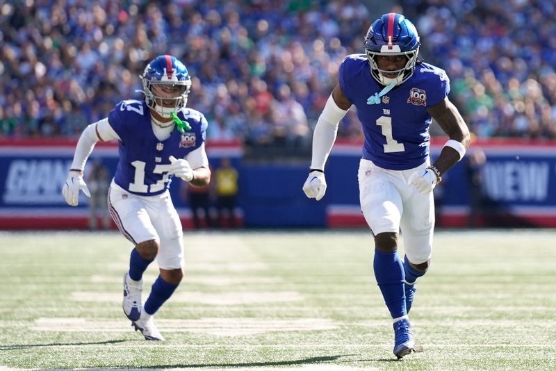 New York Giants wide receiver Malik Nabers (1) and wide receiver Wan'Dale Robinson (17) run a route against the Philadelphia Eagles during the second quarter of an NFL football game, Sunday, Oct. 20, 2024, in East Rutherford, N.J. (AP Photo/Seth Wenig)