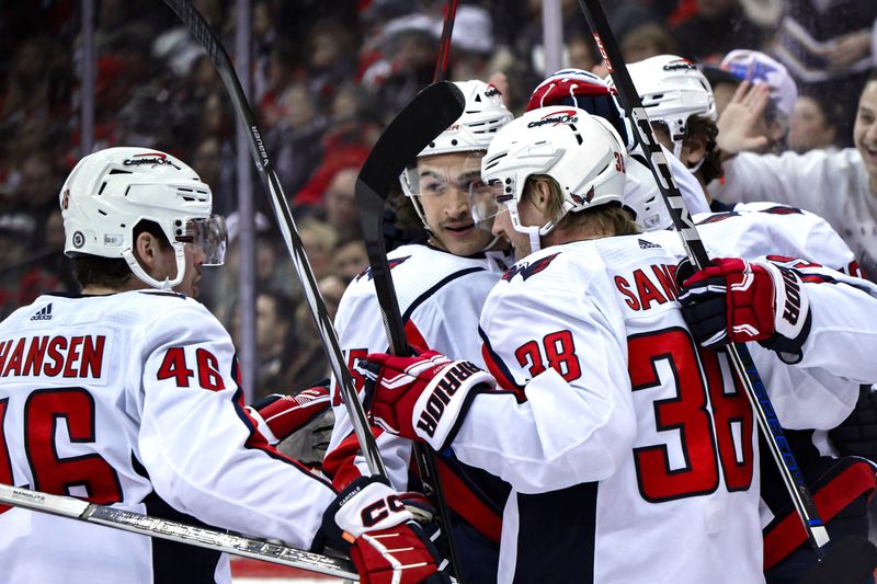 Nov 10, 2023; Newark, New Jersey, USA; Washington Capitals right wing Nicolas Aube-Kubel (96) celebrates with teammates after scoring a goal against the New Jersey Devils during the first period at Prudential Center. Mandatory Credit: John Jones-USA TODAY Sports