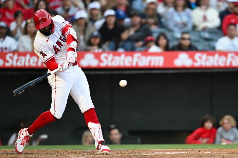 May 11, 2024; Anaheim, California, USA; Los Angeles Angels outfielder Jo Adell (7) hits a home run against the Kansas City Royals during the second inning at Angel Stadium. Mandatory Credit: Jonathan Hui-USA TODAY Sports