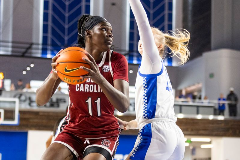 Mar 1, 2026; Lexington, Kentucky, USA; Kentucky Wildcats guard Gabby Brooks (11) spins toward the basket against Kentucky Wildcats center Clara Strack (13) during the first quarter at Memorial Coliseum. Mandatory Credit: Arden Barnes-Imagn Images