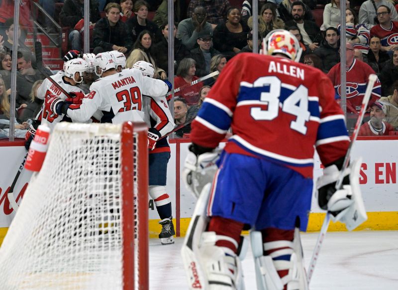 Feb 17, 2024; Montreal, Quebec, CAN; Washington Capitals forward Aliaksei Protas (21)/ celebrates with teammates after scoring a goal against Montreal Canadiens goalie Jake Allen (34) during the third period at the Bell Centre. Mandatory Credit: Eric Bolte-USA TODAY Sports