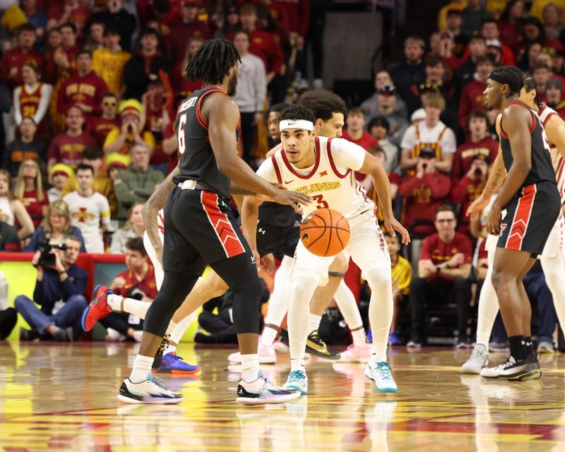 Feb 17, 2024; Ames, Iowa, USA; Texas Tech Red Raiders guard Joe Toussaint (6) controls the ball against Iowa State Cyclones guard Tamin Lipsey (3) during the second half at James H. Hilton Coliseum. Mandatory Credit: Reese Strickland-USA TODAY Sports