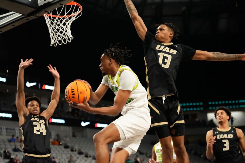 Mar 16, 2024; Fort Worth, TX, USA;  South Florida Bulls guard Kobe Knox (4) passes the ball between UAB Blazers guard Efrem Johnson (24) and Christian Coleman (13) during the first half at Dickies Arena. Mandatory Credit: Chris Jones-USA TODAY Sports