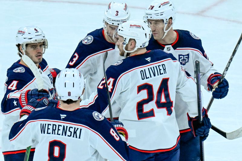 Jan 30, 2026; Chicago, Illinois, USA;  Columbus Blue Jackets right wing Mathieu Olivier (24) celebrates with teammates after scoring against the Chicago Blackhawks during the second period at the United Center. Mandatory Credit: Matt Marton-Imagn Images