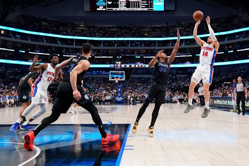 DALLAS, TEXAS - APRIL 12: Malachi Flynn #14 of the Detroit Pistons shoots over Brandon Williams #00 of the Dallas Mavericks during the second half at American Airlines Center on April 12, 2024 in Dallas, Texas. NOTE TO USER: User expressly acknowledges and agrees that, by downloading and or using this photograph, User is consenting to the terms and conditions of the Getty Images License Agreement. (Photo by Sam Hodde/Getty Images)