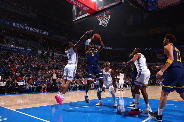 OKLAHOMA CITY, OK - DECEMBER 8: Kevon Looney #5 of the Golden State Warriors drives to the basket during the game against the Oklahoma City Thunder on December 8, 2023 at Paycom Arena in Oklahoma City, Oklahoma. NOTE TO USER: User expressly acknowledges and agrees that, by downloading and or using this photograph, User is consenting to the terms and conditions of the Getty Images License Agreement. Mandatory Copyright Notice: Copyright 2023 NBAE (Photo by Zach Beeker/NBAE via Getty Images)