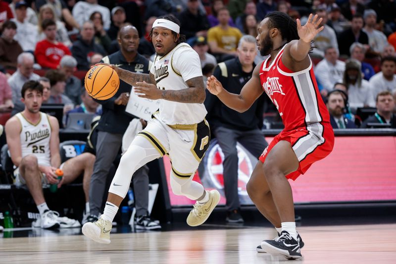 Mar 11, 2023; Chicago, IL, USA; Purdue Boilermakers guard David Jenkins Jr. (14) drives to the basket against Ohio State Buckeyes guard Bruce Thornton (2) during the second half at United Center. Mandatory Credit: Kamil Krzaczynski-USA TODAY Sports