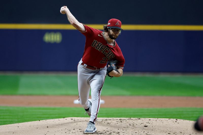 Oct 4, 2023; Milwaukee, Wisconsin, USA; Arizona Diamondbacks starting pitcher Zac Gallen (23) pitches against the Milwaukee Brewers in the first inning during game two of the Wildcard series for the 2023 MLB playoffs at American Family Field. Mandatory Credit: Kamil Krzaczynski-USA TODAY Sports