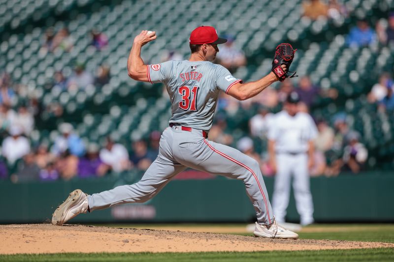 Jun 5, 2024; Denver, Colorado, USA; Cincinnati Reds relief pitcher Brent Suter (31) delivers a pitch during the ninth inning against the Colorado Rockies at Coors Field. Mandatory Credit: Andrew Wevers-USA TODAY Sports