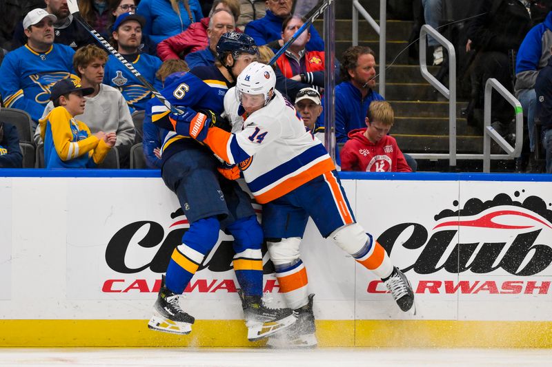 Oct 17, 2024; St. Louis, Missouri, USA;  New York Islanders center Bo Horvat (14) checks St. Louis Blues defenseman Philip Broberg (6) during the third period at Enterprise Center. Mandatory Credit: Jeff Curry-Imagn Images