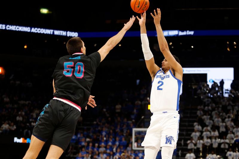 Feb 25, 2024; Memphis, Tennessee, USA; Memphis Tigers forward Nicholas Jourdain (2) shoots as Florida Atlantic Owls center Vladislav Goldin (50) defends during the first half at FedExForum. Mandatory Credit: Petre Thomas-USA TODAY Sports