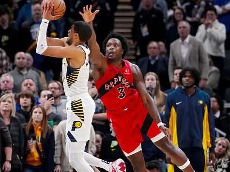 INDIANAPOLIS, INDIANA - NOVEMBER 22: Tyrese Haliburton #0 of the Indiana Pacers attempts a shot while being guarded by OG Anunoby #3 of the Toronto Raptors in the fourth quarter at Gainbridge Fieldhouse on November 22, 2023 in Indianapolis, Indiana. NOTE TO USER: User expressly acknowledges and agrees that, by downloading and or using this photograph, User is consenting to the terms and conditions of the Getty Images License Agreement. (Photo by Dylan Buell/Getty Images)