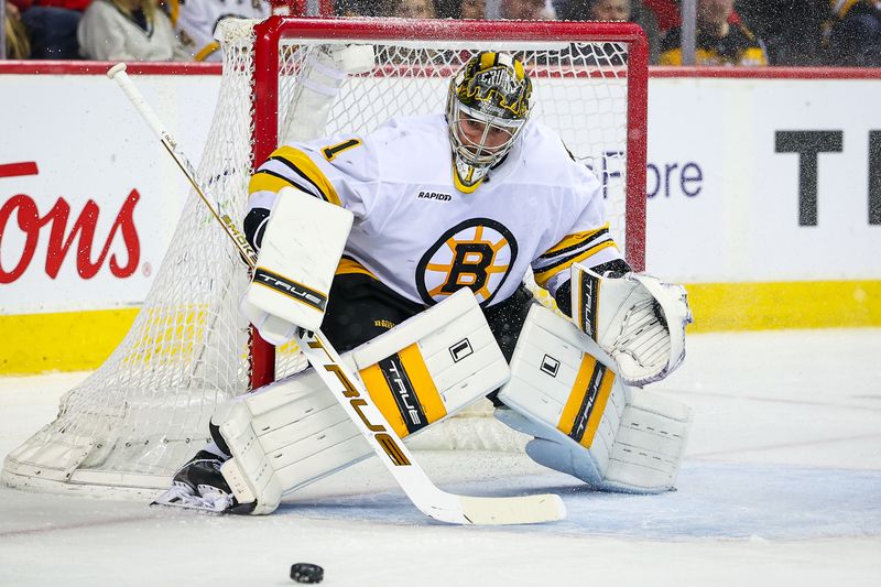 Dec 29, 2025; Calgary, Alberta, CAN; Boston Bruins goaltender Jeremy Swayman (1) guards his net against the Calgary Flames during the second period at Scotiabank Saddledome. Mandatory Credit: Sergei Belski-Imagn Images