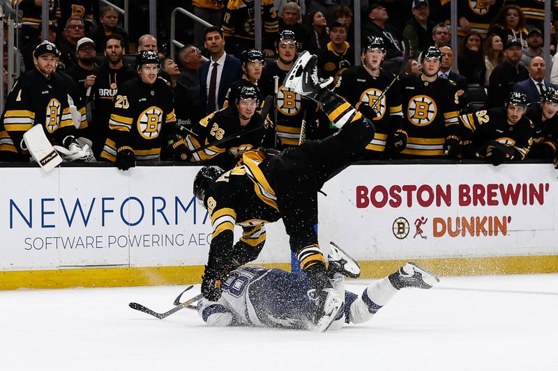 Oct 13, 2025; Boston, Massachusetts, USA; Boston Bruins right wing David Pastrnak (88) checks Tampa Bay Lightning right wing Nikita Kucherov (86) to the ice during the third period at TD Garden. Mandatory Credit: Winslow Townson-Imagn Images