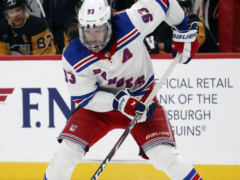 Mar 16, 2024; Pittsburgh, Pennsylvania, USA;  New York Rangers center Mika Zibanejad (93) handles the puck against the Pittsburgh Penguins during the first period at PPG Paints Arena. Mandatory Credit: Charles LeClaire-USA TODAY Sports