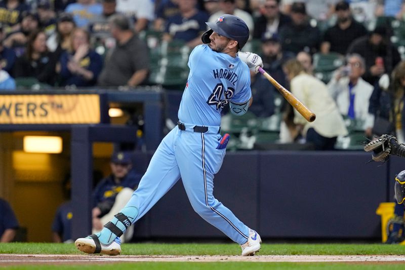 Jun 10, 2024; Milwaukee, Wisconsin, USA;  Toronto Blue Jays second baseman Spencer Horwitz (48) hits a double during the first inning against the Milwaukee Brewers at American Family Field. Mandatory Credit: Jeff Hanisch-USA TODAY Sports