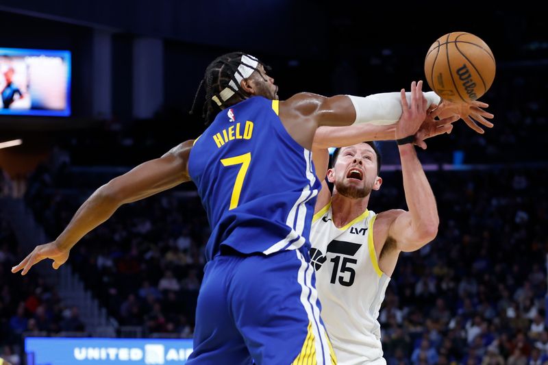 SAN FRANCISCO, CALIFORNIA - JANUARY 28: Buddy Hield #7 of the Golden State Warriors competes against Drew Eubanks #15 of the Utah Jazz in the third quarter at Chase Center on January 28, 2025 in San Francisco, California. NOTE TO USER: User expressly acknowledges and agrees that, by downloading and or using this photograph, User is consenting to the terms and conditions of the Getty Images License Agreement. (Photo by Lachlan Cunningham/Getty Images)