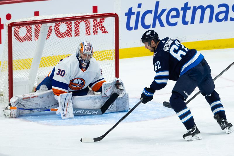 Jan 16, 2024; Winnipeg, Manitoba, CAN; New York Islanders goalie Ilya Sorokin (30) prepares for a shot by Winnipeg Jets forward Nino Niederreiter (62) during the third period at Canada Life Centre. Mandatory Credit: Terrence Lee-USA TODAY Sports