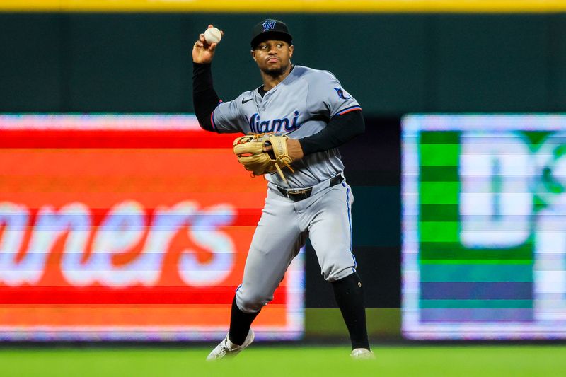 Jul 12, 2024; Cincinnati, Ohio, USA; Miami Marlins shortstop Xavier Edwards (63) throws to first to get Cincinnati Reds second baseman Jonathan India (not pictured) out in the eighth inning at Great American Ball Park. Mandatory Credit: Katie Stratman-USA TODAY Sports