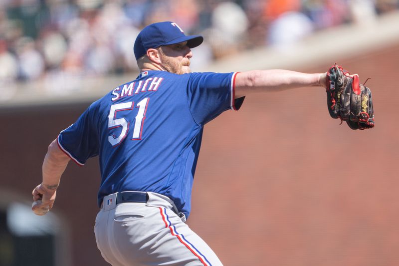 Aug 13, 2023; San Francisco, California, USA; Texas Rangers relief pitcher Will Smith (51) pitches during the tenth inning against the San Francisco Giants at Oracle Park. Mandatory Credit: Stan Szeto-USA TODAY Sports