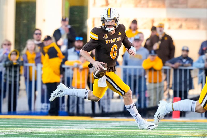 Sep 23, 2023; Laramie, Wyoming, USA; Wyoming Cowboys quarterback Andrew Peasley (6) runs against the Appalachian State Mountaineers during the second quarter at Jonah Field at War Memorial Stadium. Mandatory Credit: Troy Babbitt-USA TODAY Sports