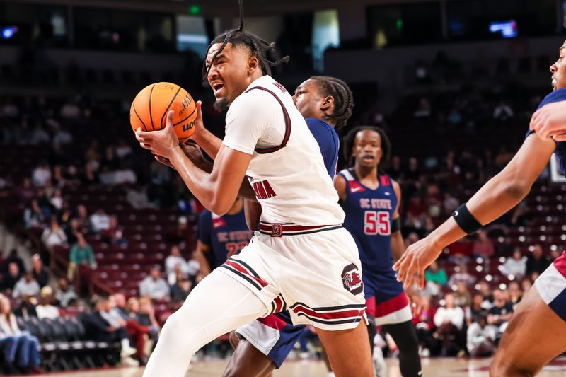 Dec 22, 2025; Columbia, South Carolina, USA; South Carolina Gamecocks guard Kobe Knox (4) drives against the South Carolina State Bulldogs in the first half at Colonial Life Arena. Mandatory Credit: Jeff Blake-Imagn Images