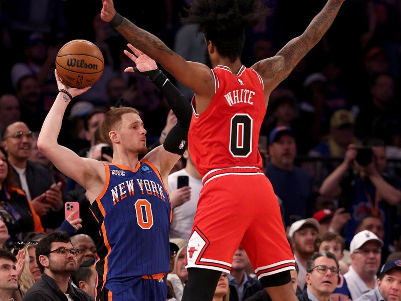 NEW YORK, NEW YORK - APRIL 14:  Donte DiVincenzo #0 of the New York Knicks tries to inbound the ball as Coby White #0 of the Chicago Bulls defends at Madison Square Garden on April 14, 2024 in New York City. The New York Knicks defeated the Chicago Bulls 120-119 in OT. NOTE TO USER: User expressly acknowledges and agrees that, by downloading and or using this photograph, User is consenting to the terms and conditions of the Getty Images License Agreement. (Photo by Elsa/Getty Images)