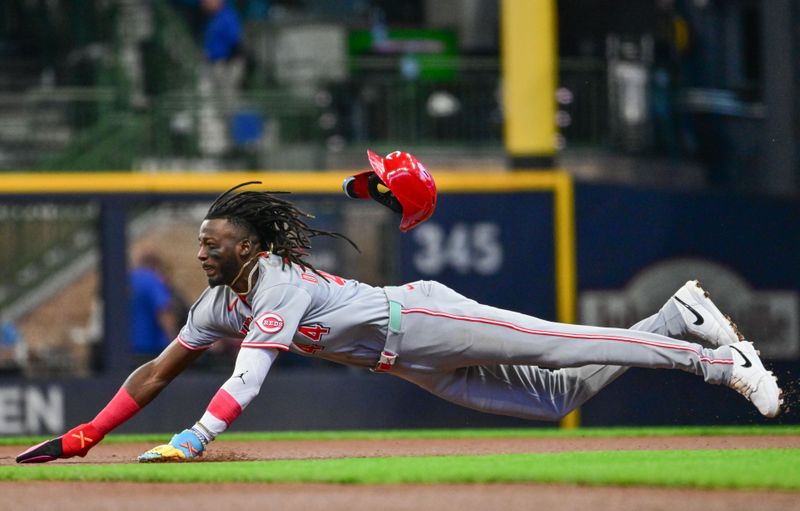 Apr 6, 2025; Milwaukee, Wisconsin, USA; Cincinnati Reds shortstop Elly De La Cruz (44) attempts to steal second base in the first inning against the Milwaukee Brewers but was called out at American Family Field. Mandatory Credit: Benny Sieu-Imagn Images