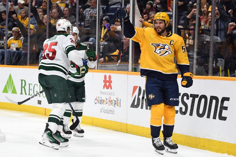 Feb 29, 2024; Nashville, Tennessee, USA; Nashville Predators defenseman Roman Josi (59) celebrates after a goal during the third period against the Minnesota Wild at Bridgestone Arena. Mandatory Credit: Christopher Hanewinckel-USA TODAY Sports