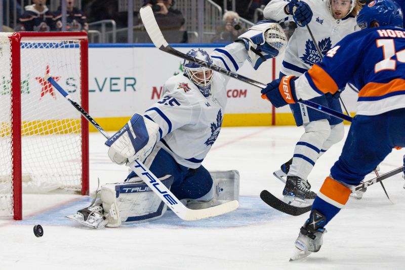 Dec 11, 2023; Elmont, New York, USA; Toronto Maple Leafs goaltender Ilya Samsonov (35) makes a save against the New York Islanders during the second period at UBS Arena. Mandatory Credit: Thomas Salus-USA TODAY Sports