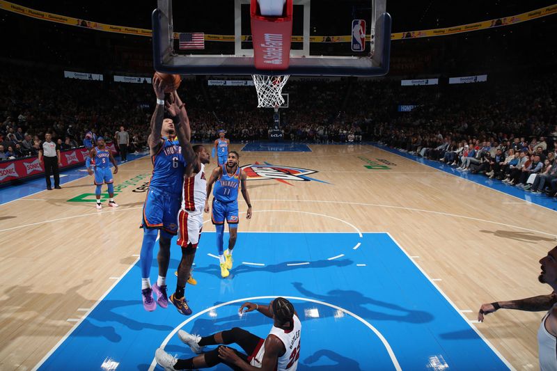 OKLAHOMA CITY, OK - MARCH 8:  Jaylin Williams #6 of the Oklahoma City Thunder grabs a rebound during the game against the Miami Heat on March 8, 2024 at Paycom Arena in Oklahoma City, Oklahoma. NOTE TO USER: User expressly acknowledges and agrees that, by downloading and or using this photograph, User is consenting to the terms and conditions of the Getty Images License Agreement. Mandatory Copyright Notice: Copyright 2024 NBAE (Photo by Zach Beeker/NBAE via Getty Images)