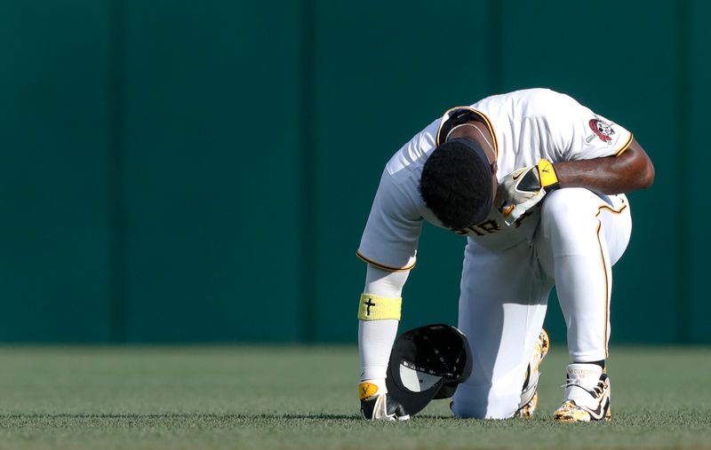 May 9, 2023; Pittsburgh, Pennsylvania, USA;  Pittsburgh Pirates designated hitter Andrew McCutchen (22) pauses for a moment in the outfield before the game against the Colorado Rockies at PNC Park. Mandatory Credit: Charles LeClaire-USA TODAY Sports