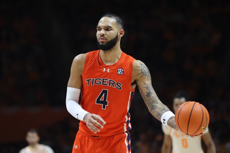 Feb 28, 2024; Knoxville, Tennessee, USA; Auburn Tigers forward Johni Broome (4) looks to move the ball against the Tennessee Volunteers during the second half at Thompson-Boling Arena at Food City Center. Mandatory Credit: Randy Sartin-USA TODAY Sports