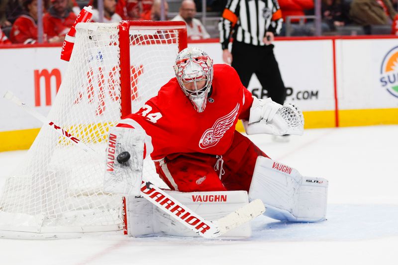 Dec 29, 2023; Detroit, Michigan, USA; Detroit Red Wings goaltender Matt Lyon (34) blocks a shot during the third period of the game between the Detroit Red Wings and the Nashville Predators at Little Caesars Arena. Mandatory Credit: Brian Bradshaw Sevald-USA TODAY Sports