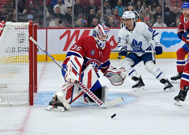 Oct 9, 2024; Montreal, Quebec, CAN; Montreal Canadiens goalie Sam Montembeault (35) stops the puck in front of Toronto Maple Leafs forward William Nylander (88) during the first period at the Bell Centre. Mandatory Credit: Eric Bolte-Imagn Images