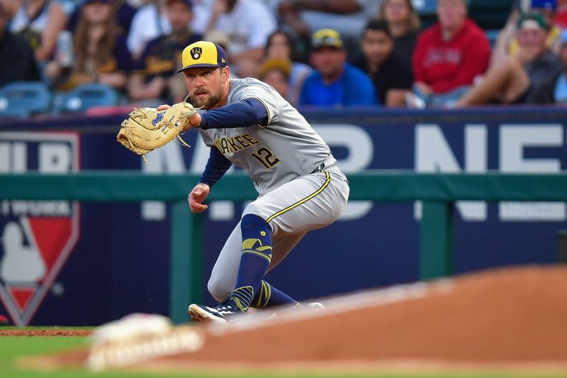 Jun 18, 2024; Anaheim, California, USA; Milwaukee Brewers first base Rhys Hoskins (12) makes the catch at first for the out against Los Angeles Angels outfielder Kevin Pillar (12) during the fourth inning at Angel Stadium. Mandatory Credit: Gary A. Vasquez-USA TODAY Sports