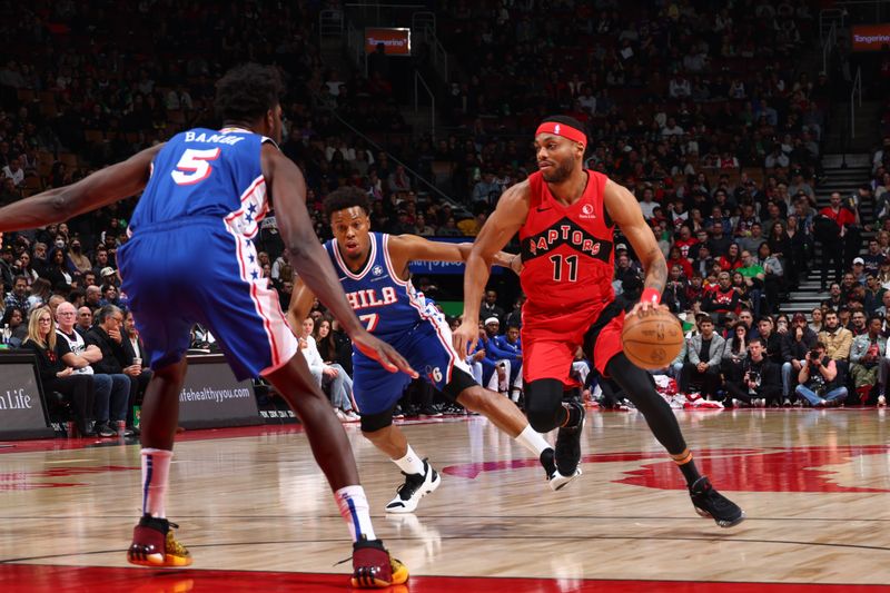 TORONTO, CANADA - MARCH 31: Bruce Brown #11 of the Toronto Raptors drives to the basket during the game against the Philadelphia 76ers on March 31, 2024 at the Scotiabank Arena in Toronto, Ontario, Canada.  NOTE TO USER: User expressly acknowledges and agrees that, by downloading and or using this Photograph, user is consenting to the terms and conditions of the Getty Images License Agreement.  Mandatory Copyright Notice: Copyright 2024 NBAE (Photo by Vaughn Ridley/NBAE via Getty Images)